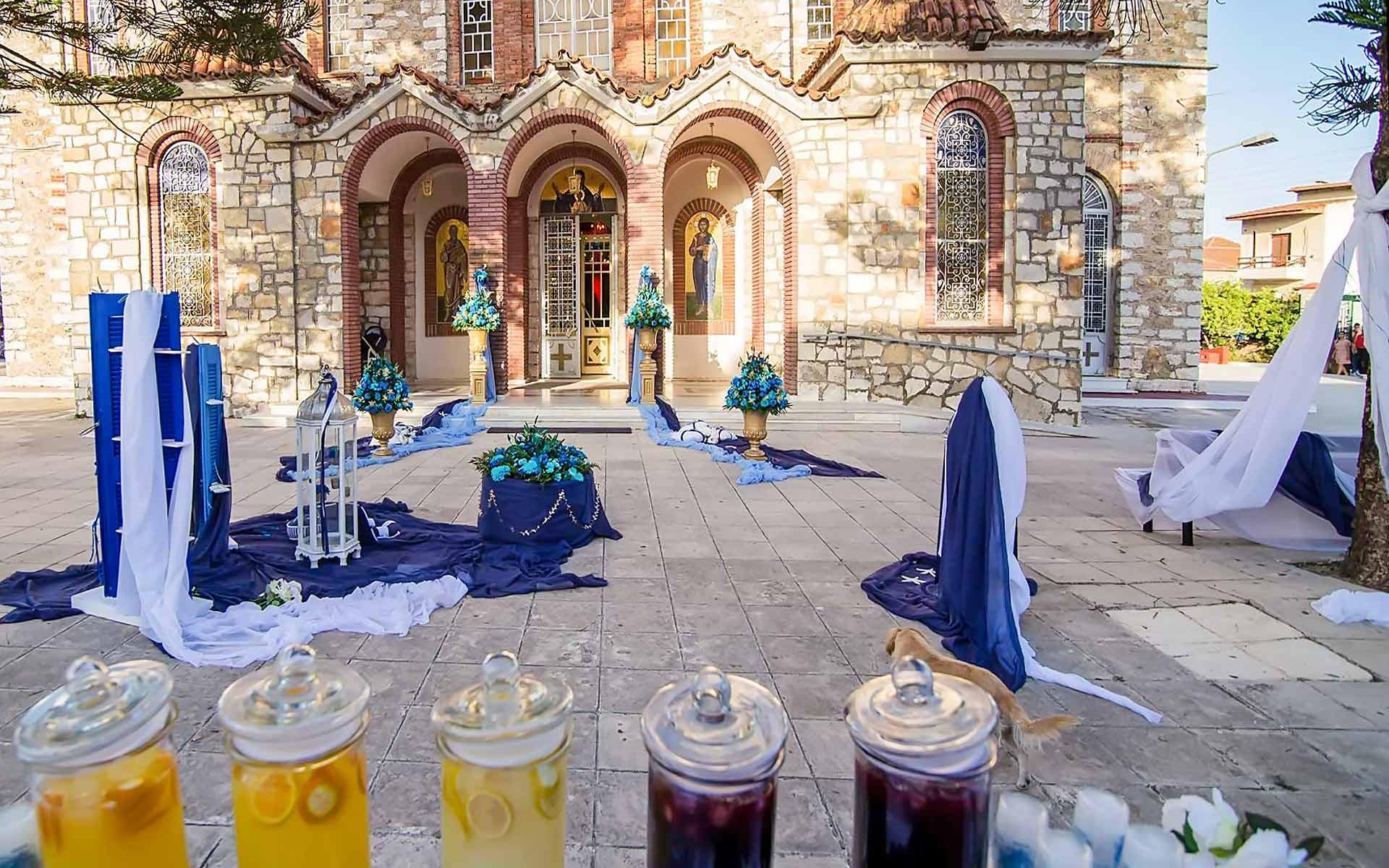 Gorgeous-Baptism-Church-Decoration-With-Blue-Flower-Arrangement-And-Gold-Urns