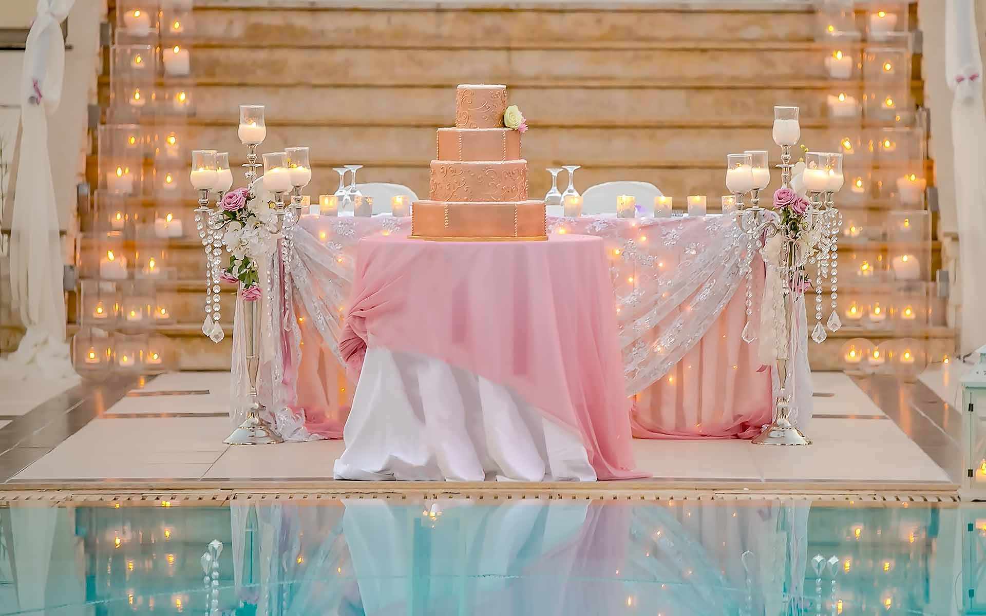 Golden-Wedding-Cake-Set-Up-In-Front-Of-The-Bridal-Table-by-Diamond-Events-Wedding-Event