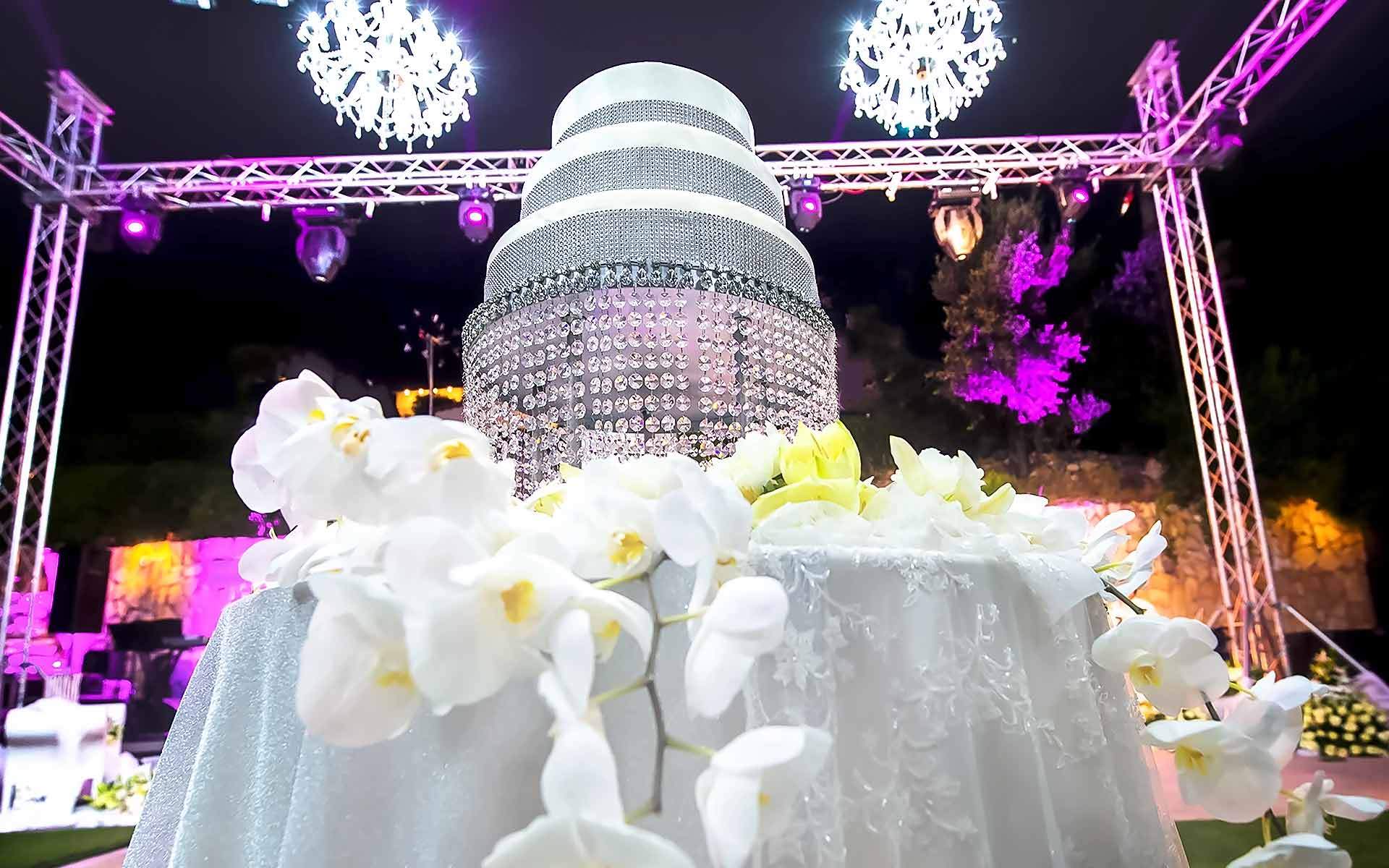 Wedding-Cake-Table-With-White-Orchids-And-A-Cake-Stand-With-Crystals-by-Diamond-Events