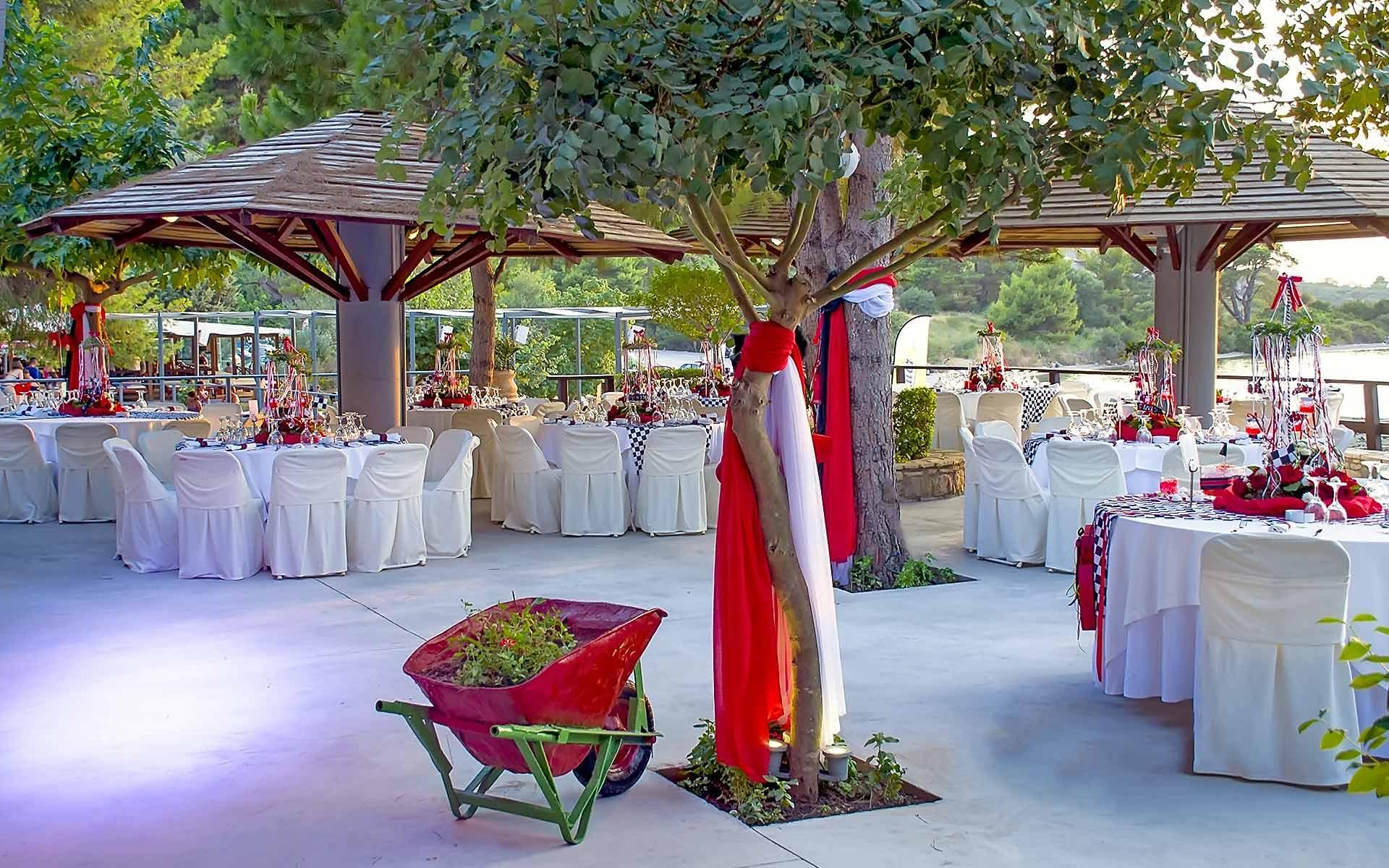 Poco-Poco-Venue-Christening-Set-Up-With-Red-Flowers-And-Flags