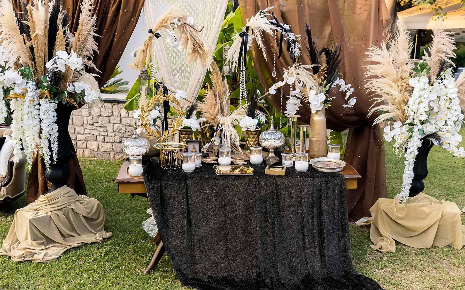 Rustic black guest book with feathers, pampas & orchids by Rogdaki Events Trademark wedding and events planning company