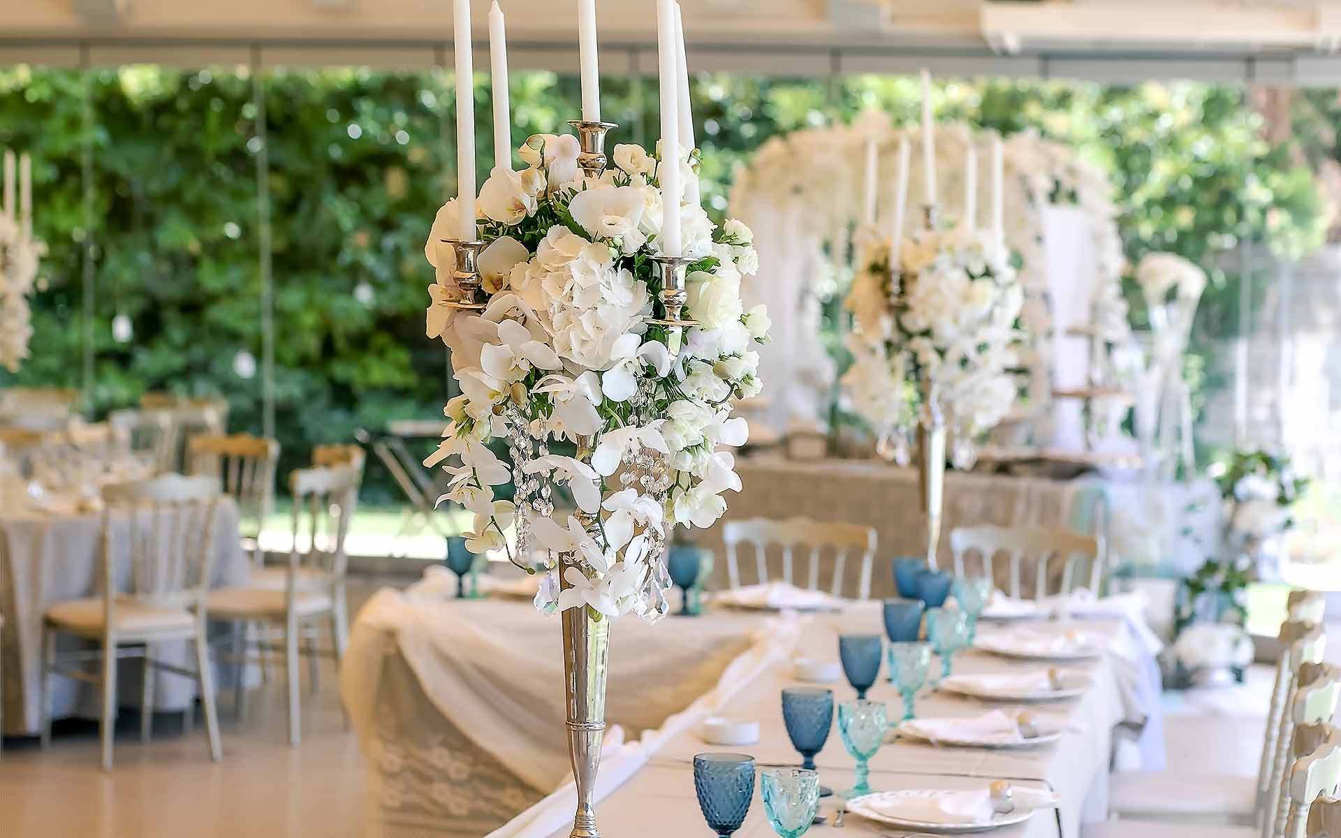 Amazing Wedding Floral Centerpieces with Candelabra by Rogdaki Events Trademark
