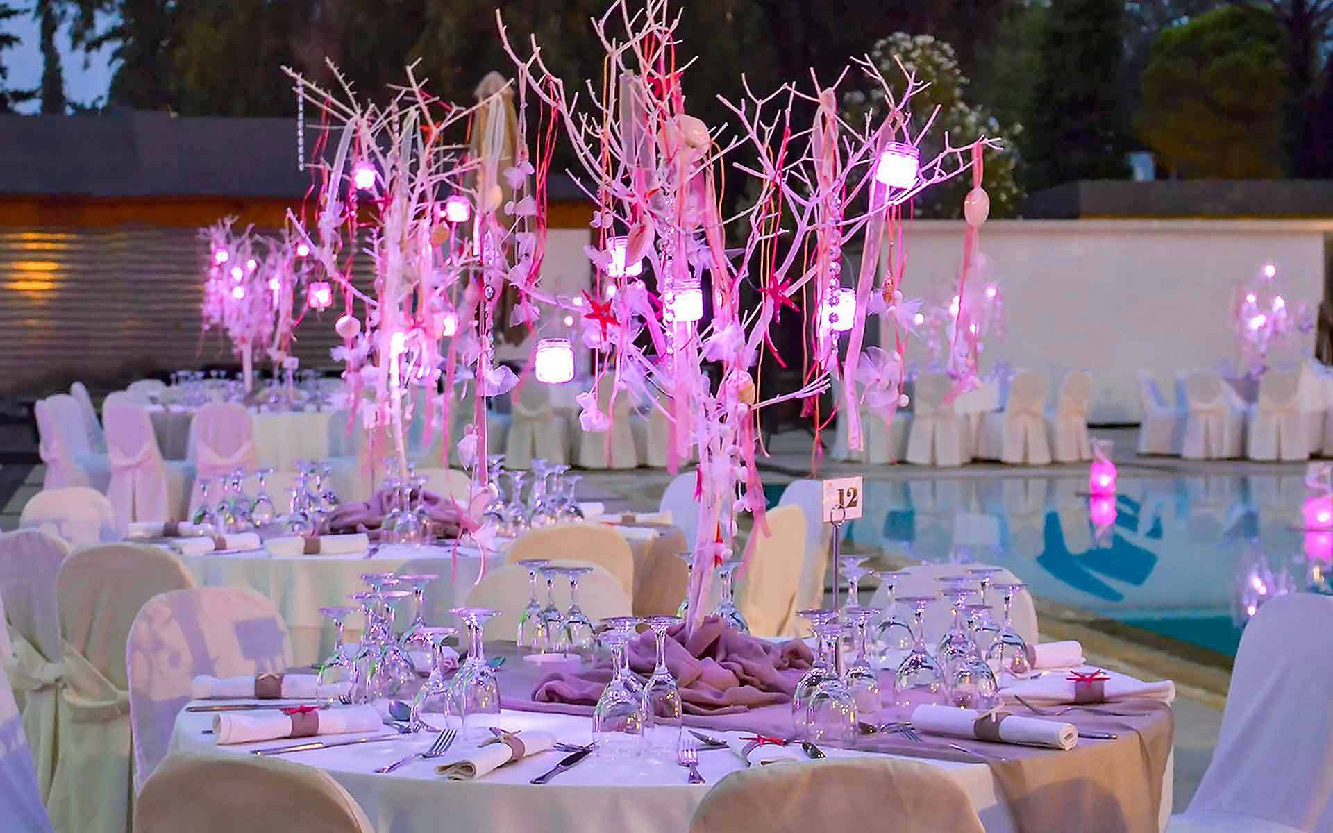 Corals In Trees In Purple Lighting As A Centerpiece In A Beach Wedding by Rogdaki Events Trademark