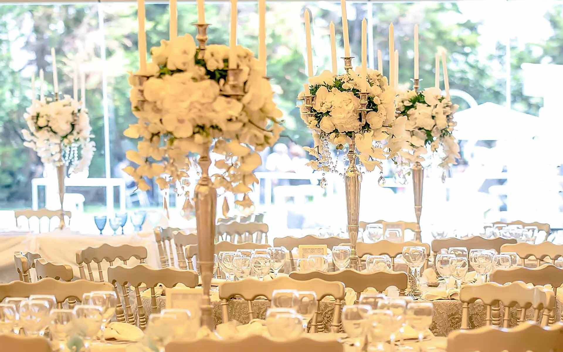 Extravagant Dream Wedding Silver candelabras with crystals and white orchids by Rogdaki Events Trademark