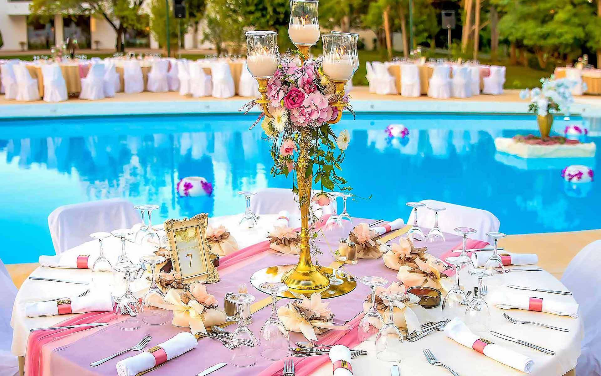Gold candlestick centerpiece in pastel colors by Rogdaki Events Trademark