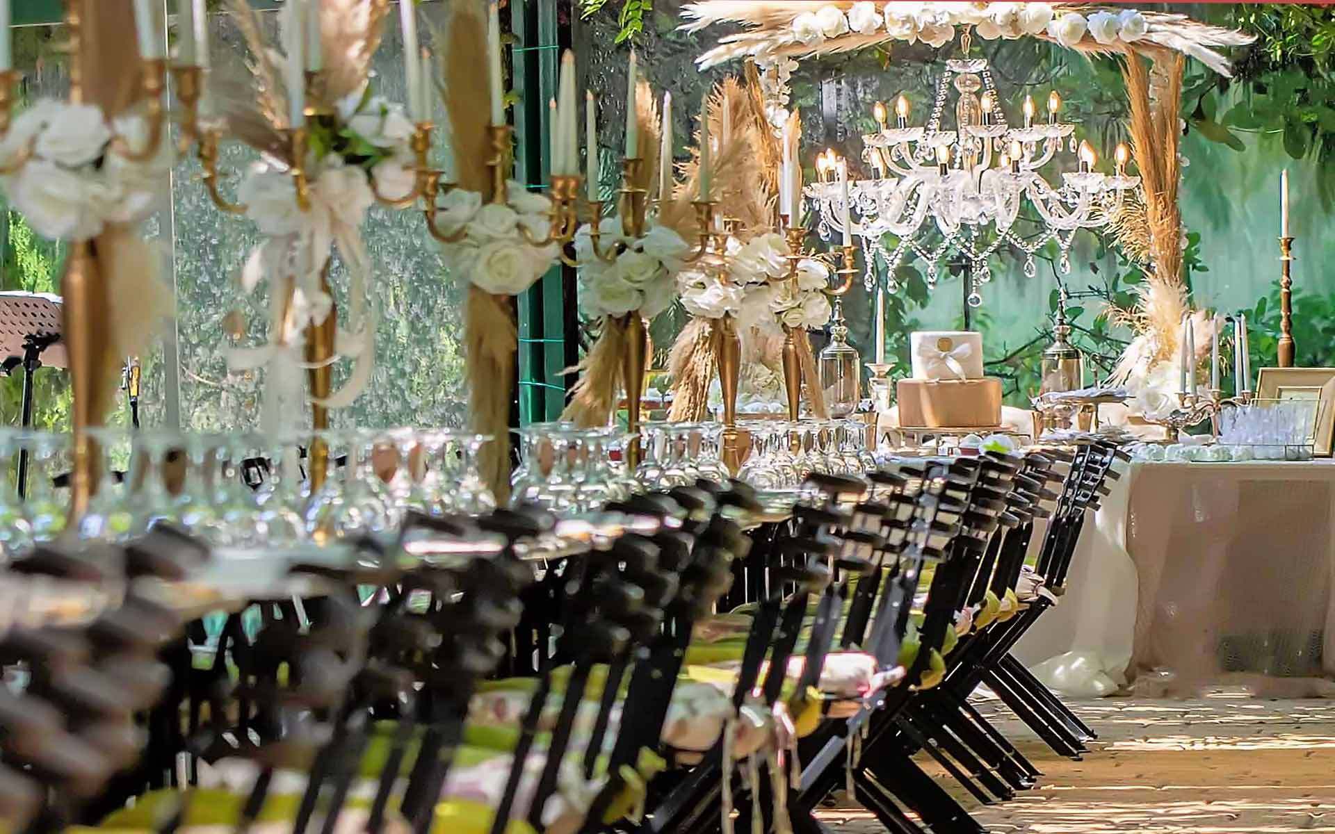 Trending Now are the gold candelabras with Pampas Grass and black iron chairs