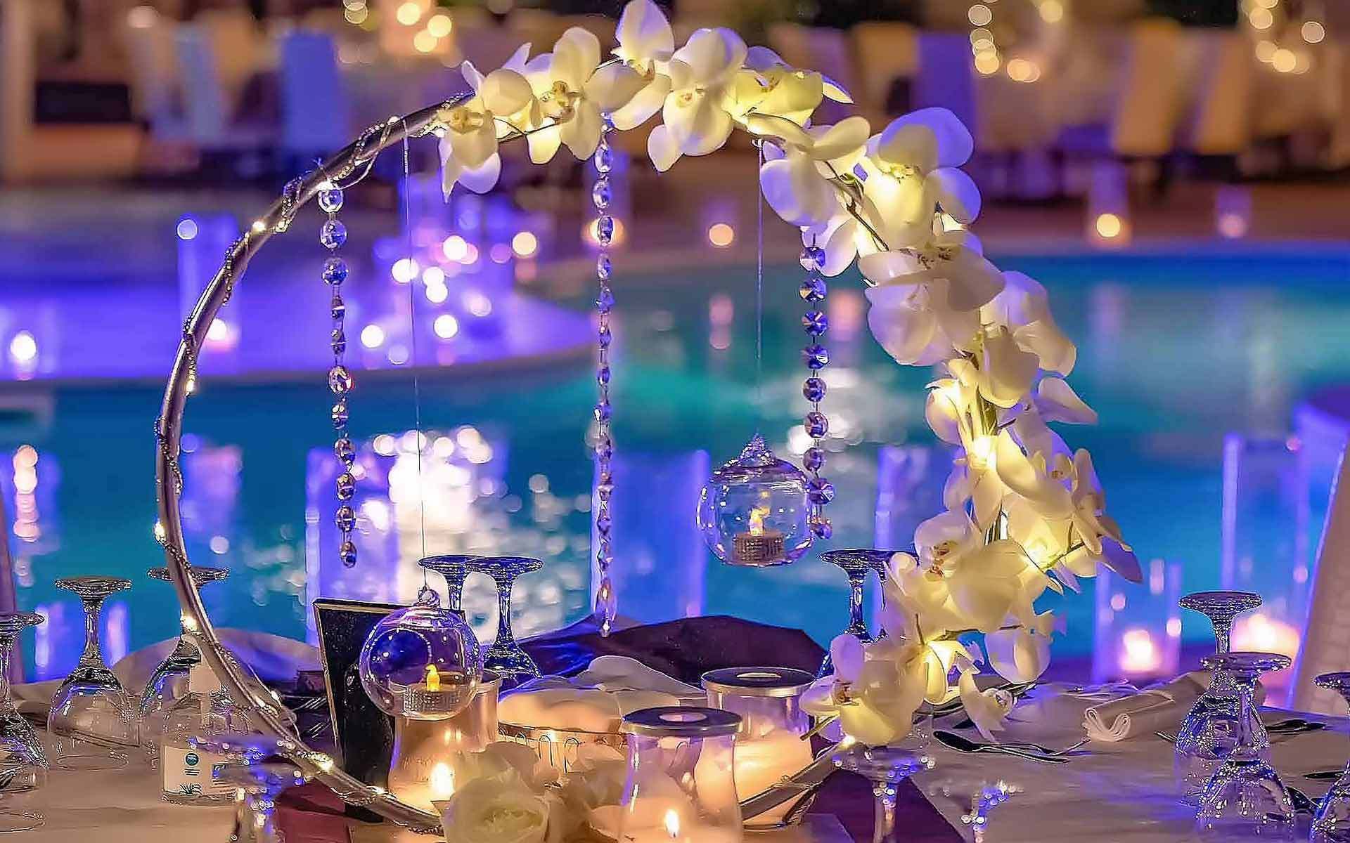 Wedding arch - metal round backdrop for wedding decor with hanging crystals & white Phaelaenopsis Orchids by Rogdaki Events Trademark