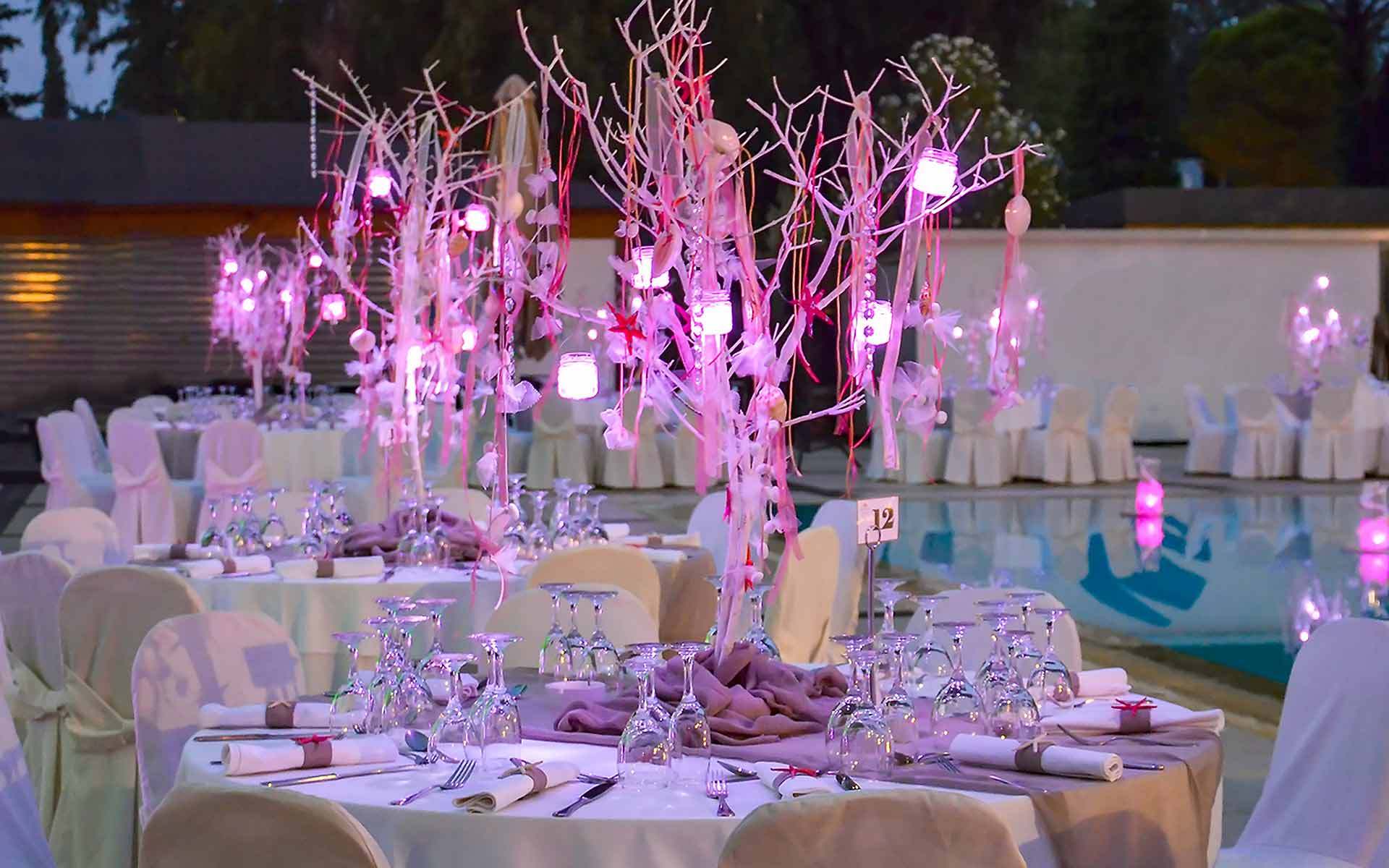 Corals-In-Trees-In-Purple-Lighting-As-A-Centerpiece-In-A-Beach-Wedding