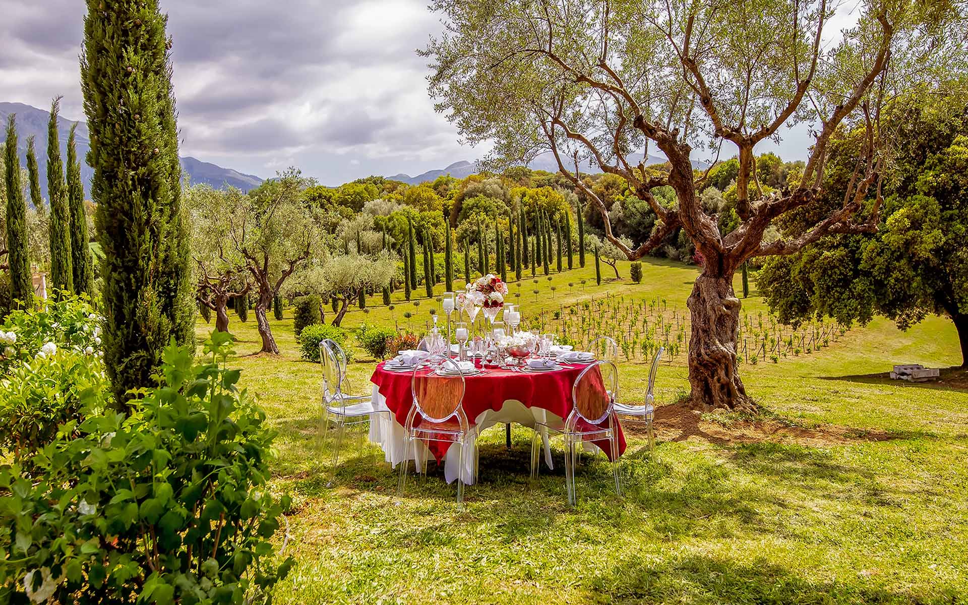 Romantic Red Table Set Up In A Field