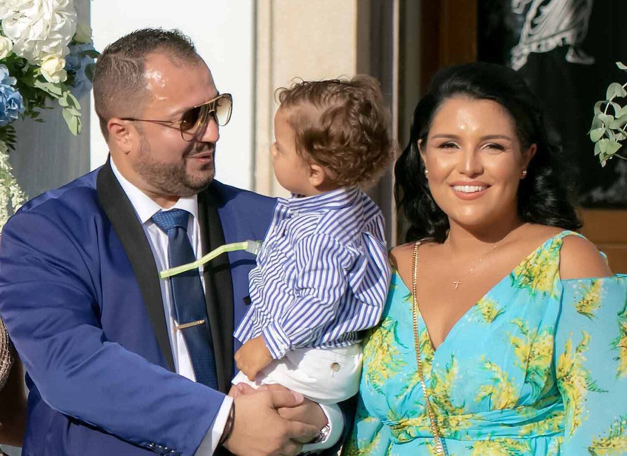The newly baptised baby with his parents Apostolis Pantazis and Anny Bakomichali Pantazis