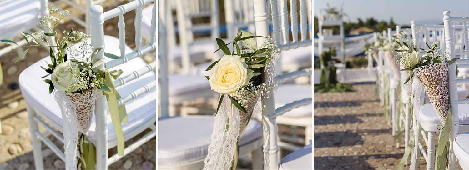 Wedding ceremony set up with white tiffany chairs with white roses decoration