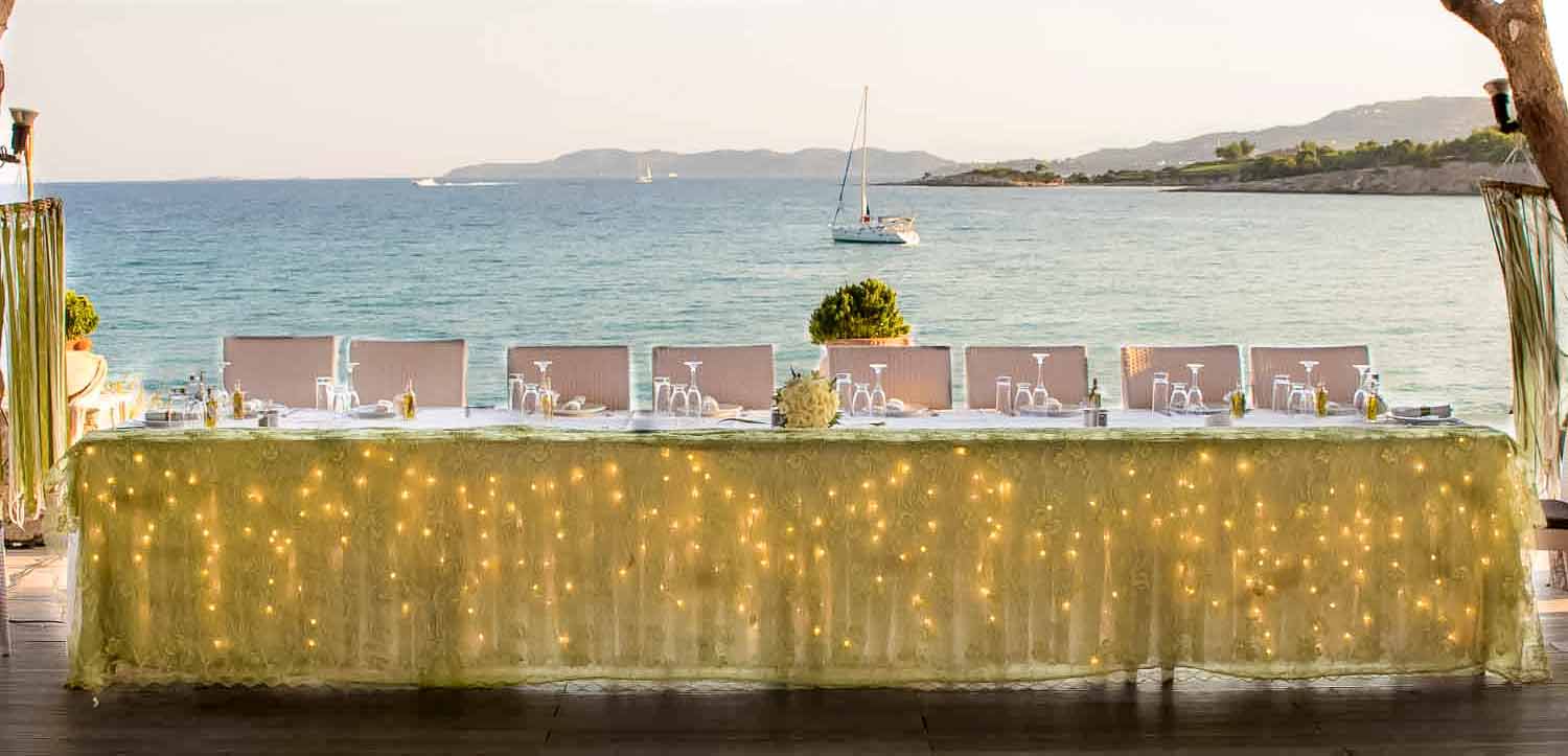 Wedding head table seating arrangement with a sea view