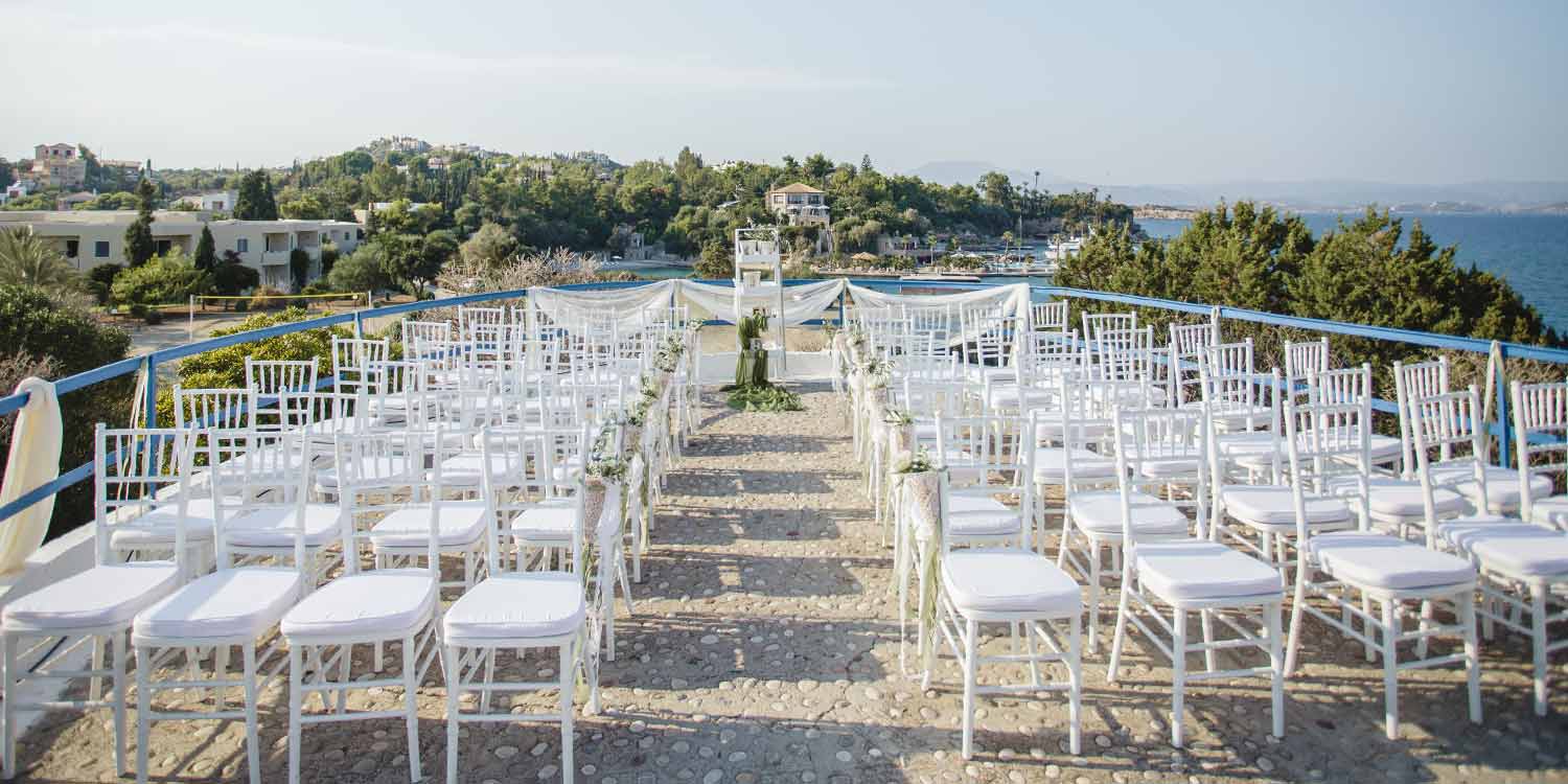 White chiavari chairs church set up by Diamond Events at Agios Aimilianos Porto Heli
