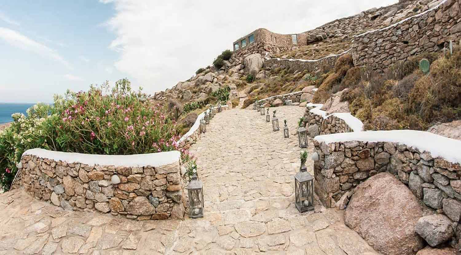 the path to the church from a group of private villas
