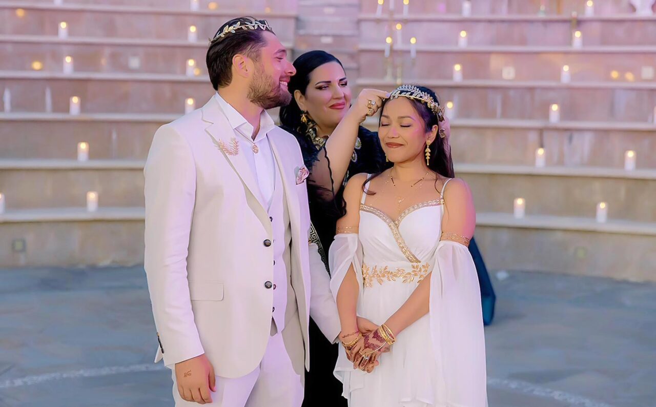 Anna Maria Rogdaki coordinating a symbolic Ancient Greek ceremony, highlighting refined styling and meaningful ritual details.