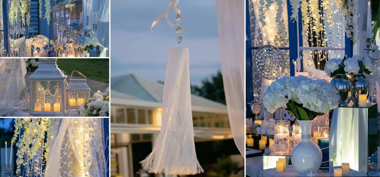 Romantic wedding decoration details in total whit. Vases lanterns crystals with fringes