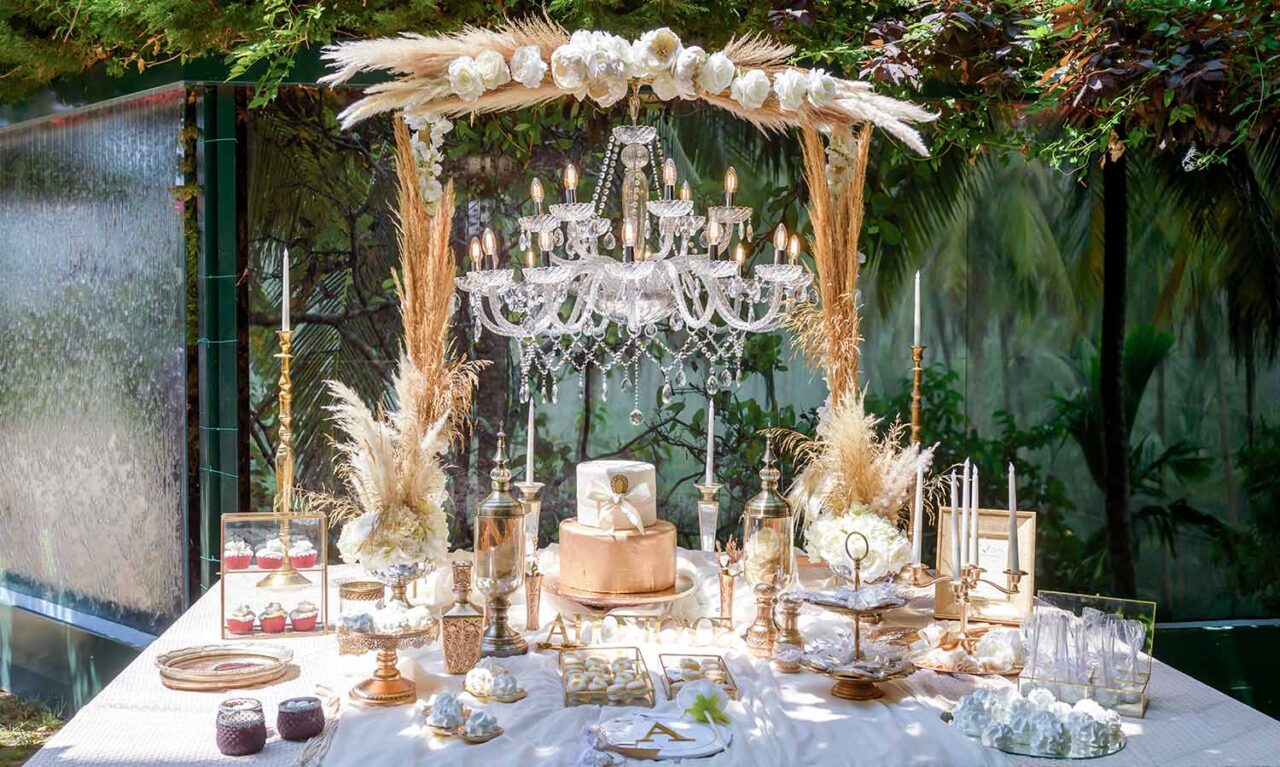 A crystal chandelier with pampas grass and white roses by Diamond Events wedding and christening 1
