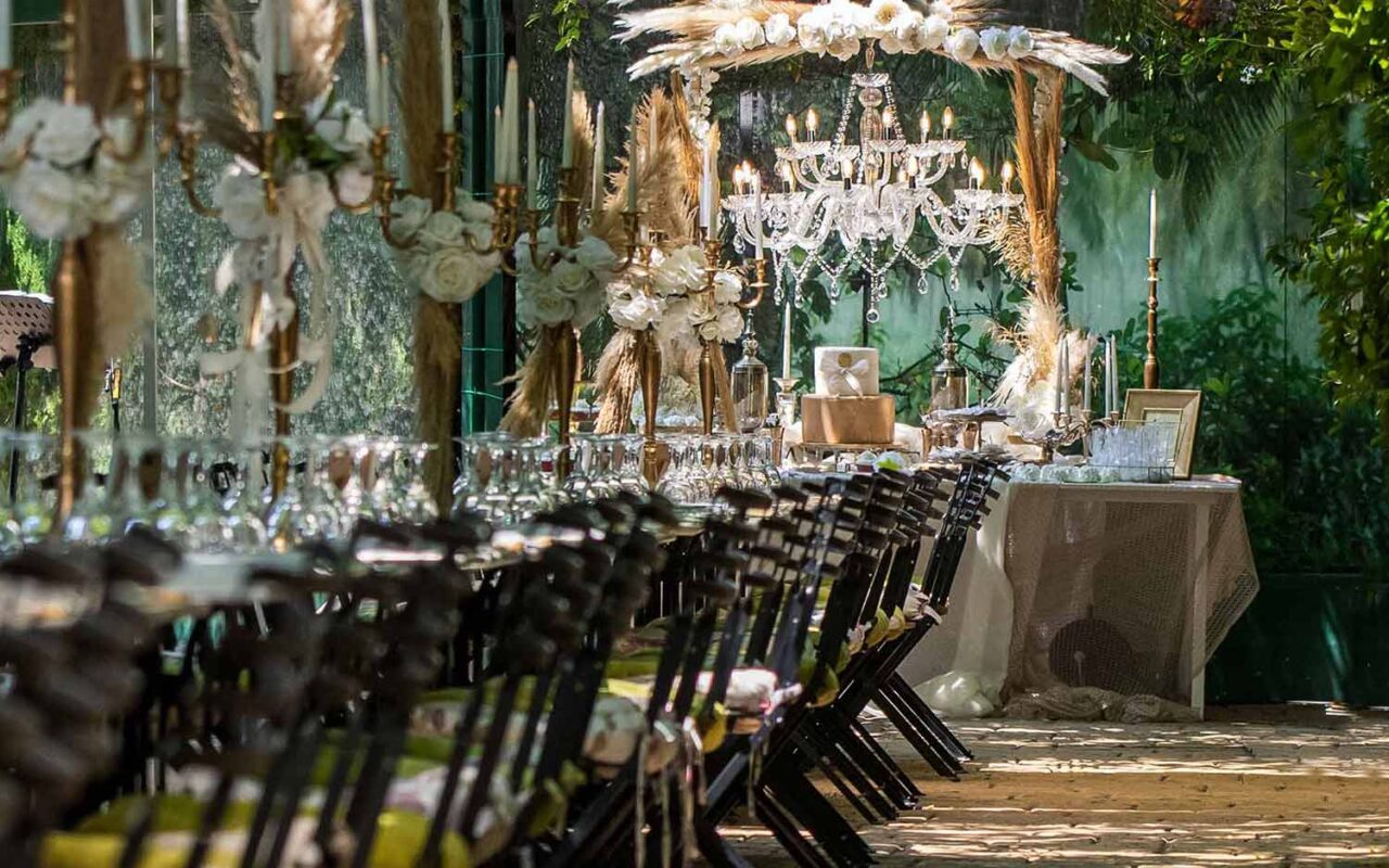 Black chairs and the wish book table with the chandelier by Diamond Events 1