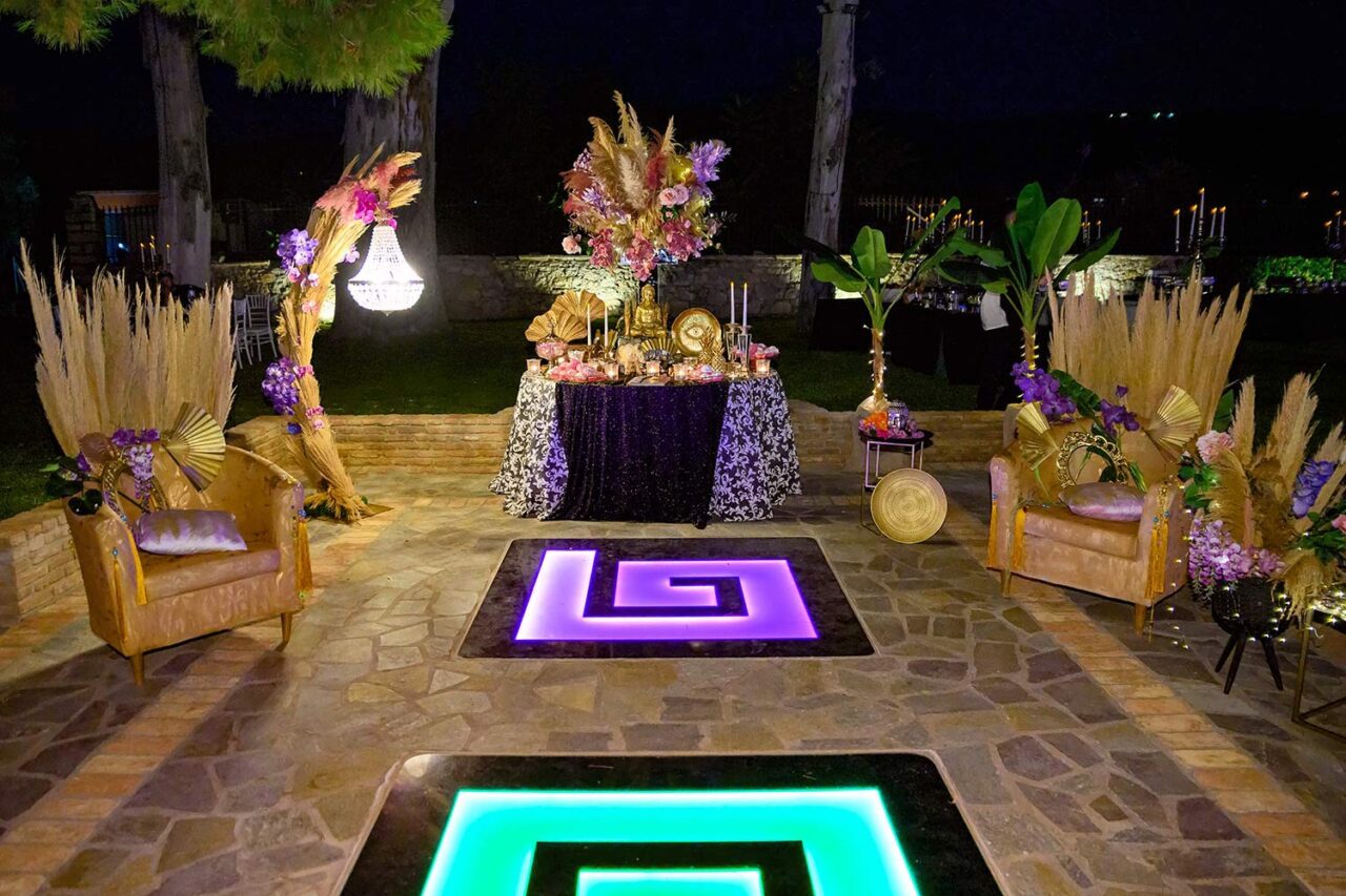 Guestbook table in a private villa for the wedding reception in Buddhist style decorated with furnitures and elements in gold colors by Rogdaki Events