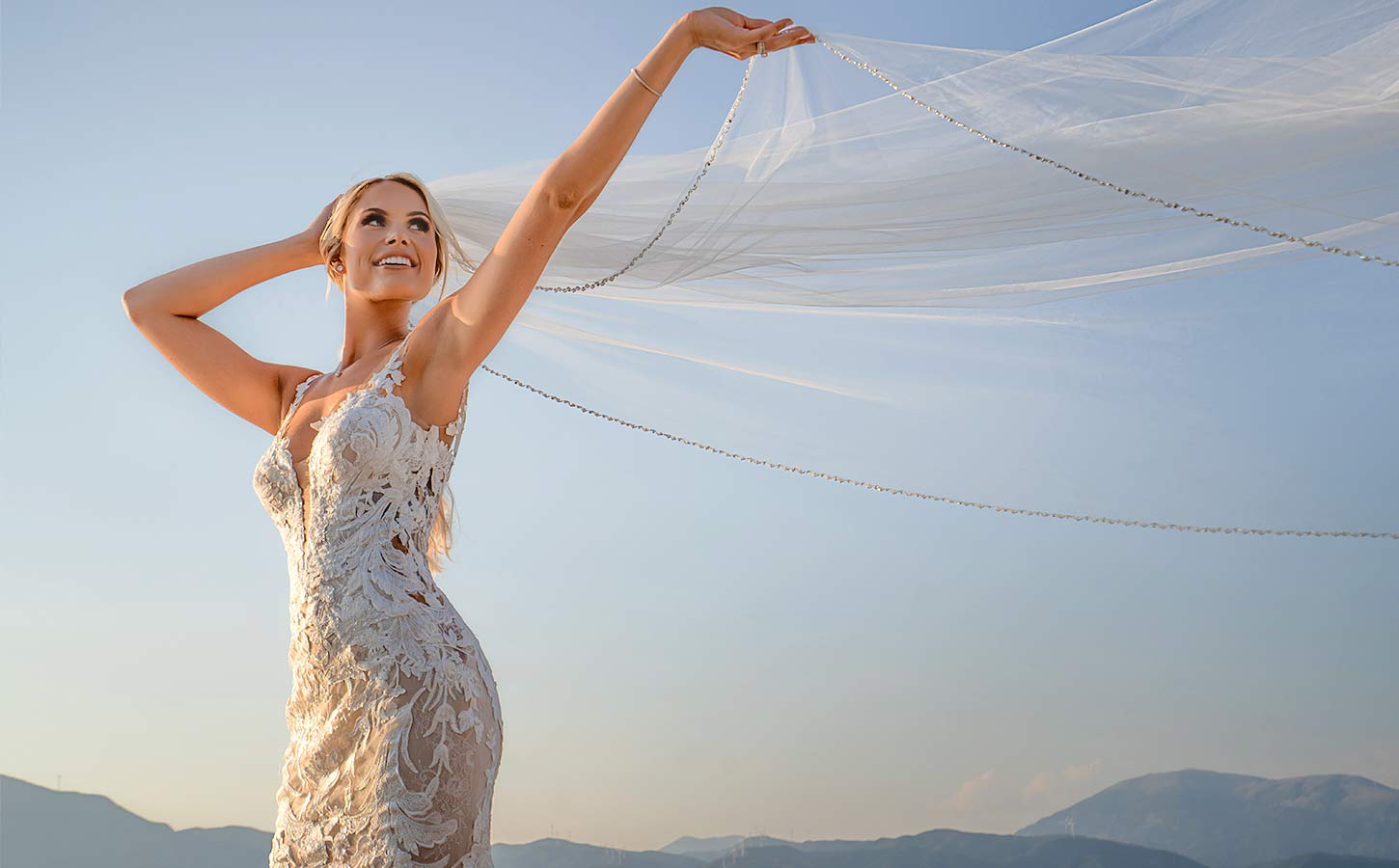 Kayla Spiropoulos posing at her Wedding in a venue with amazing view designed by Rogdaki Events
