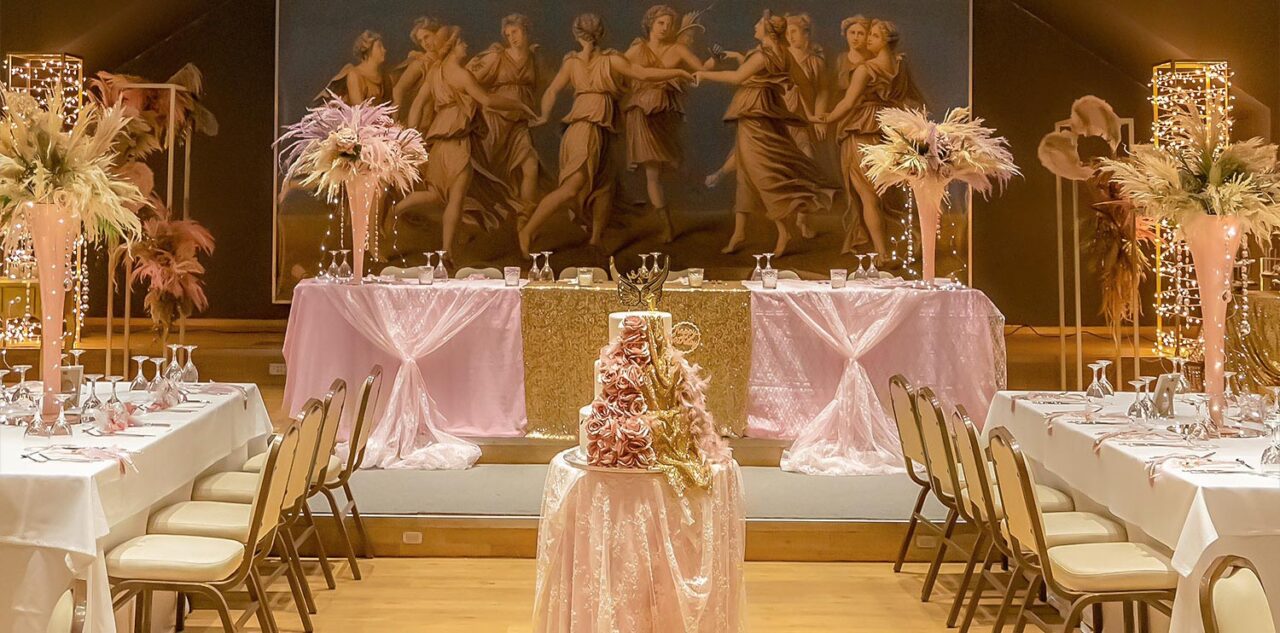 A Miracle Girl Baptism at Royal Theater — goddesses gaze as roses and glitter crown a cake fit for heavenly royalty.