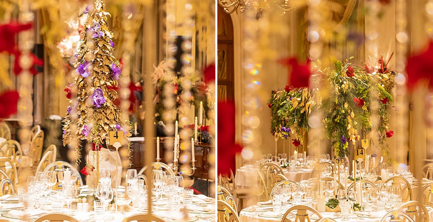 Hotel Grande Bretagne – 150 Χρόνια Ιστορίας 25 Golden trees adorned with purple orchids and red roses glow among candlelit tables, as Rogdaki Events designs an opulent festive setting for the Grande Bretagne gala