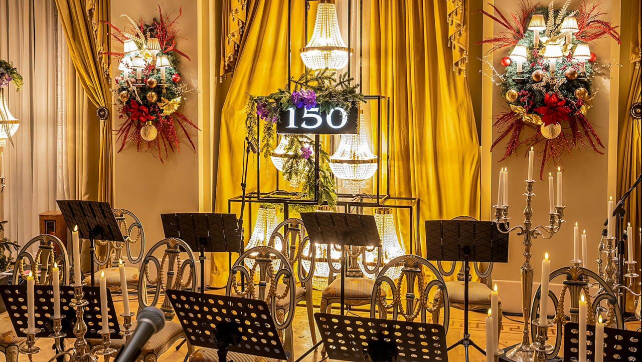 Rogdaki Events decorates the concert stage with chandeliers, golden drapery, and festive wreaths, marking 150 years of grandeur at the Hotel Grande Bretagne celebration