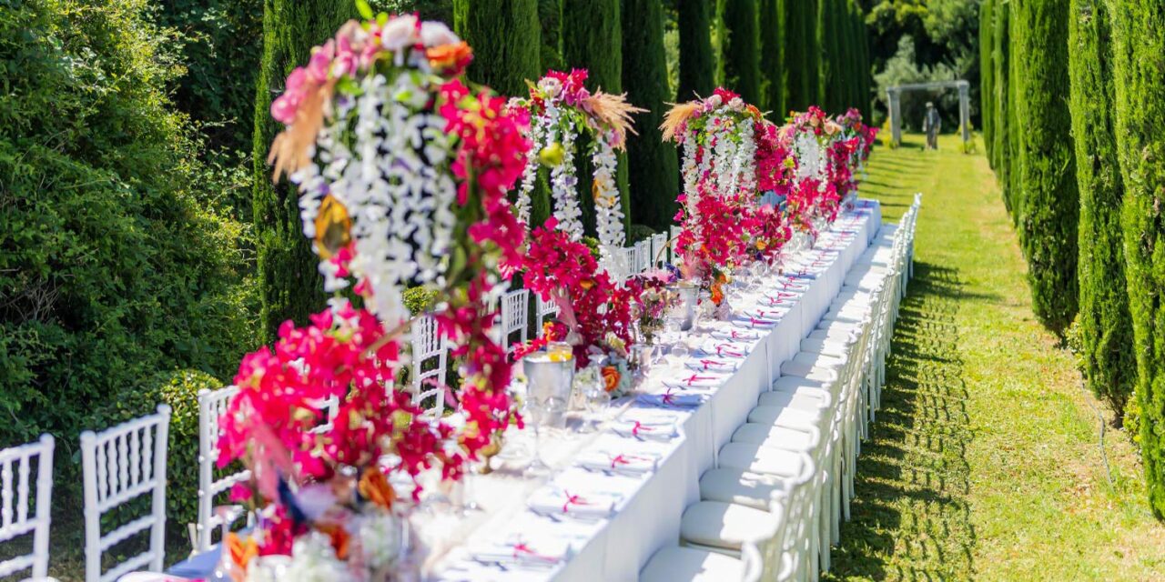 Lush floral arches crown a regal banquet setup — Indian Wedding in a Private Villa, by Rogdaki Events