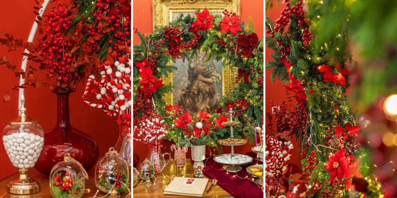 Rogdaki Events presents a stunning dessert table with wreaths, poinsettias, and red holiday decor for a Christmas baptism