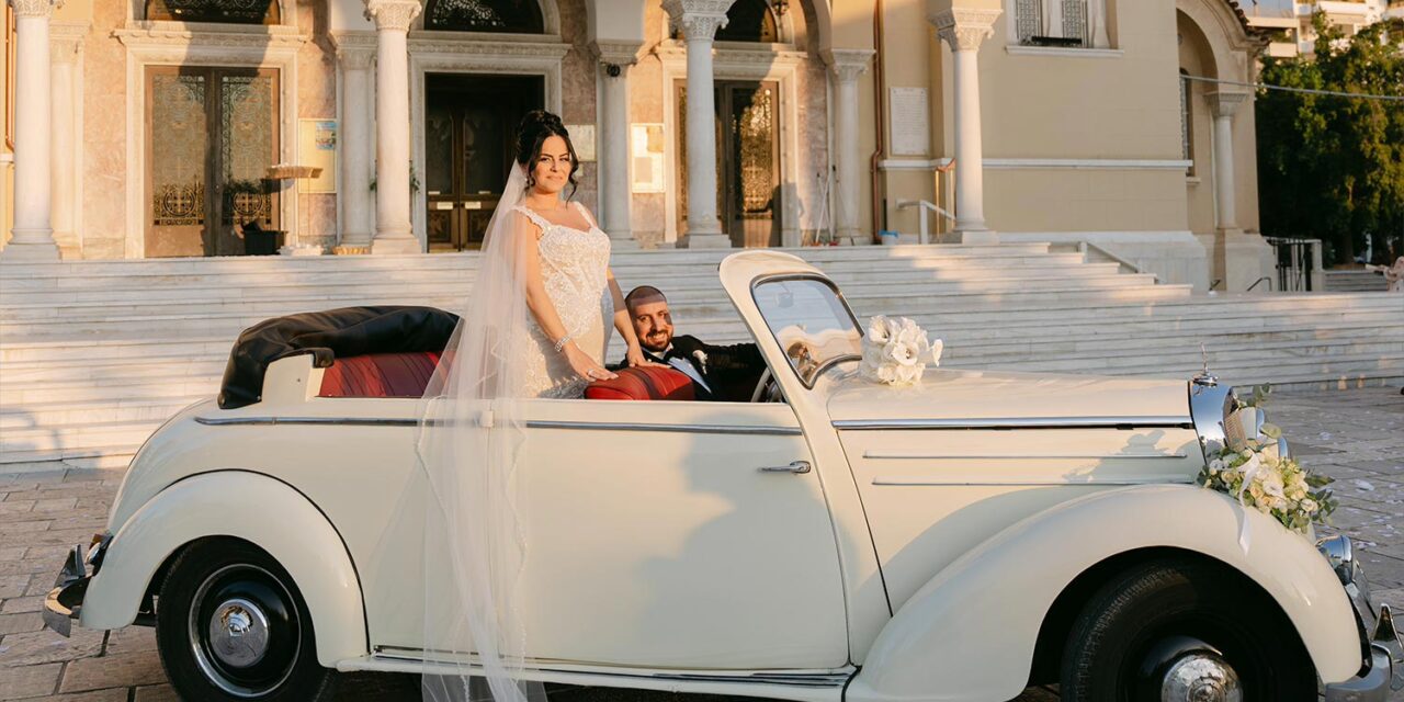 Newlyweds depart in vintage convertible, a timeless Rogdaki Events detail for a Luxury Seaside Wedding in Greece