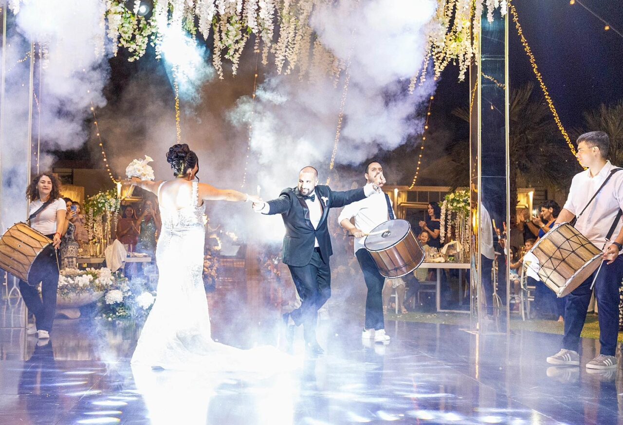 Rogdaki Events orchestrated a spectacular dance entrance with drums at this Luxury Seaside Wedding in Greece