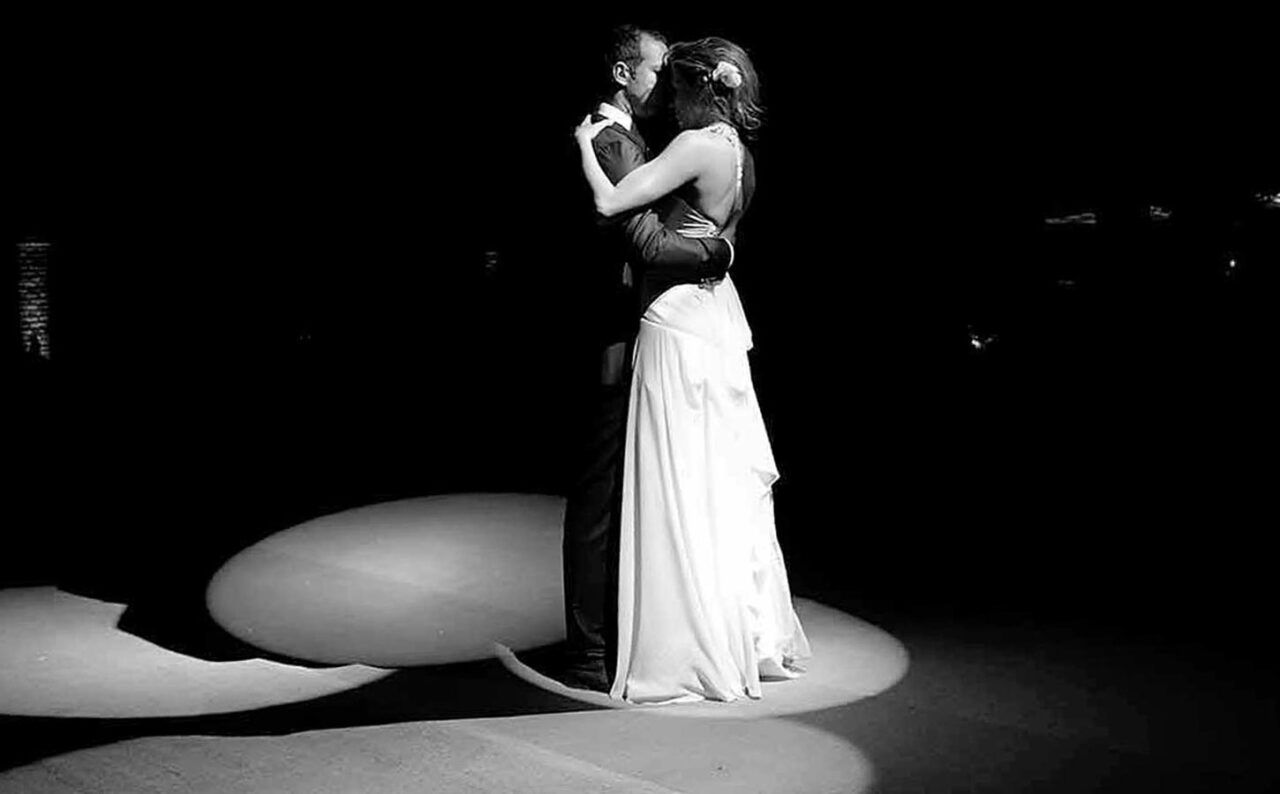 Fabulous Weddings in Greece 2 A moment of connection captured during the evening celebration, framed by elegant lighting and direction from Rogdaki Events.