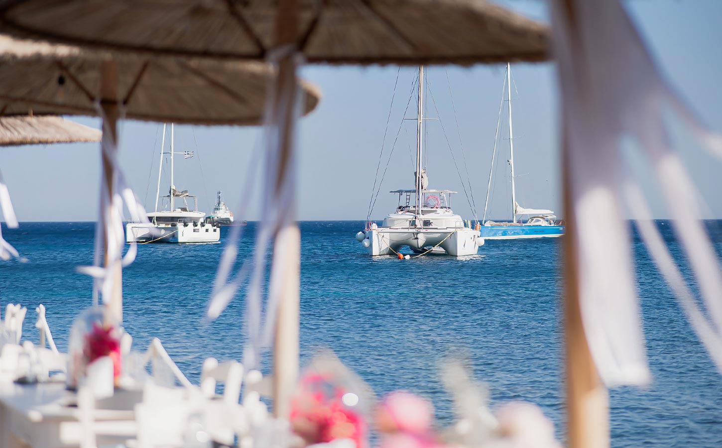 Elegant seaside dining with minimal décor and soft island light, curated by Rogdaki Events for modern celebrations