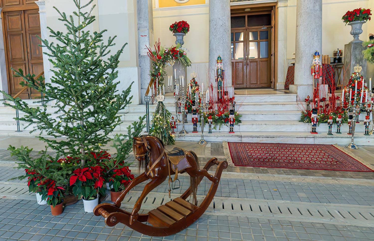 Mesmerizing Christmas Baptism Decoration 2 Christmas baptism at Mitropoli Church by Rogdaki Events. Nutcrackers, vintage horses, and red roses