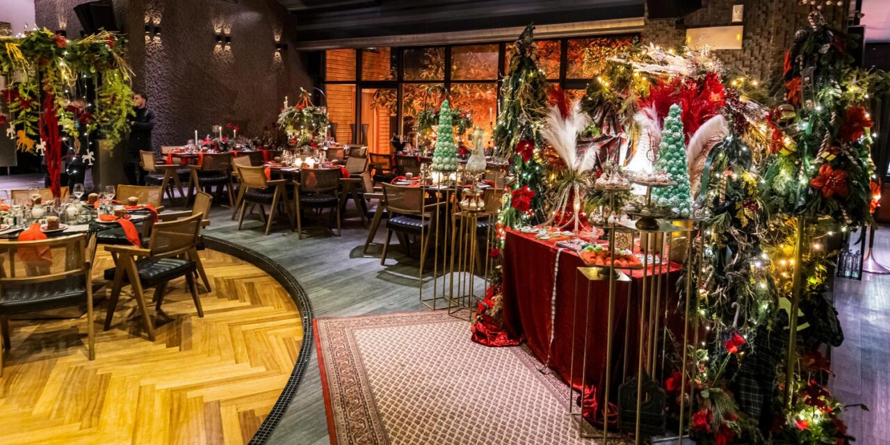 Mesmerizing Christmas Baptism Decoration 14 Christmas baptism dessert display by Rogdaki Events at Distinto—macaron trees, velvet table, and festive feathers enchant the scene