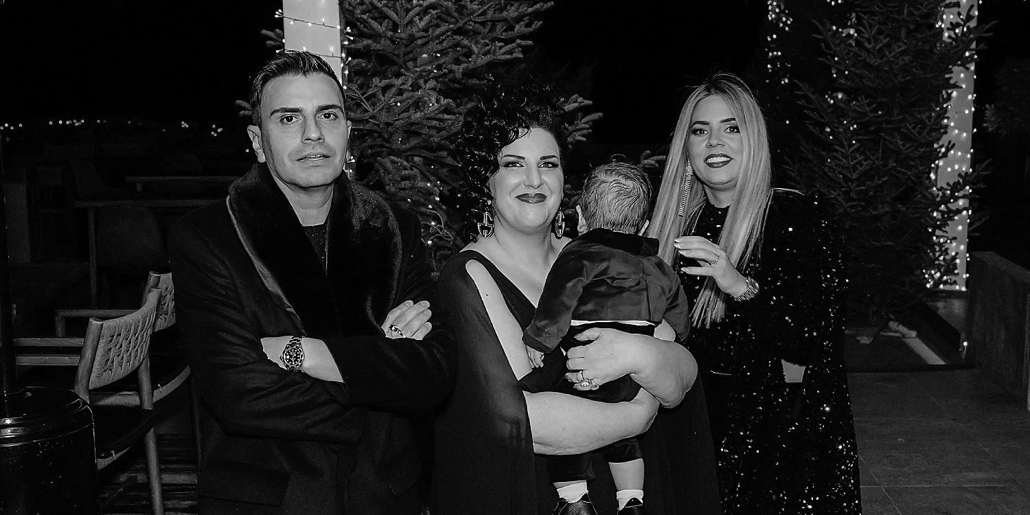Mesmerizing Christmas Baptism Decoration 38 Spyros, head designer Anna Maria Rogdaki, and Katerina pose at a festive Distinto Christmas baptism organized by Rogdaki Events