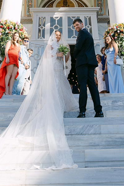 Rogdaki Events presents a chic and colorful wedding, with the couple on the church steps