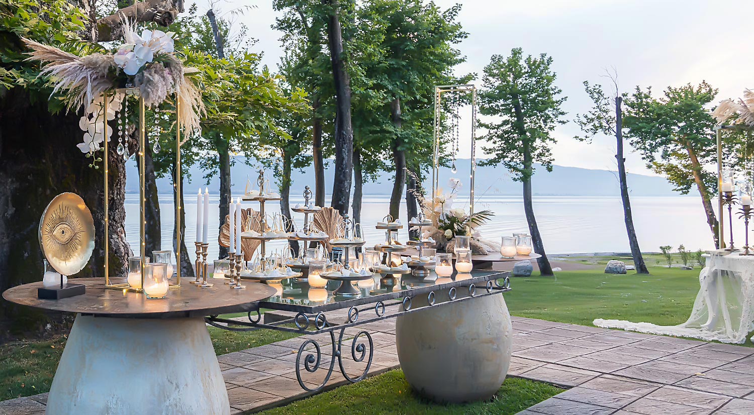 Trichonida Lake Wedding 17 Lake wedding at Pithari styled by Rogdaki Events—elegant candlelit tables, pampas florals, and golden mystical accents