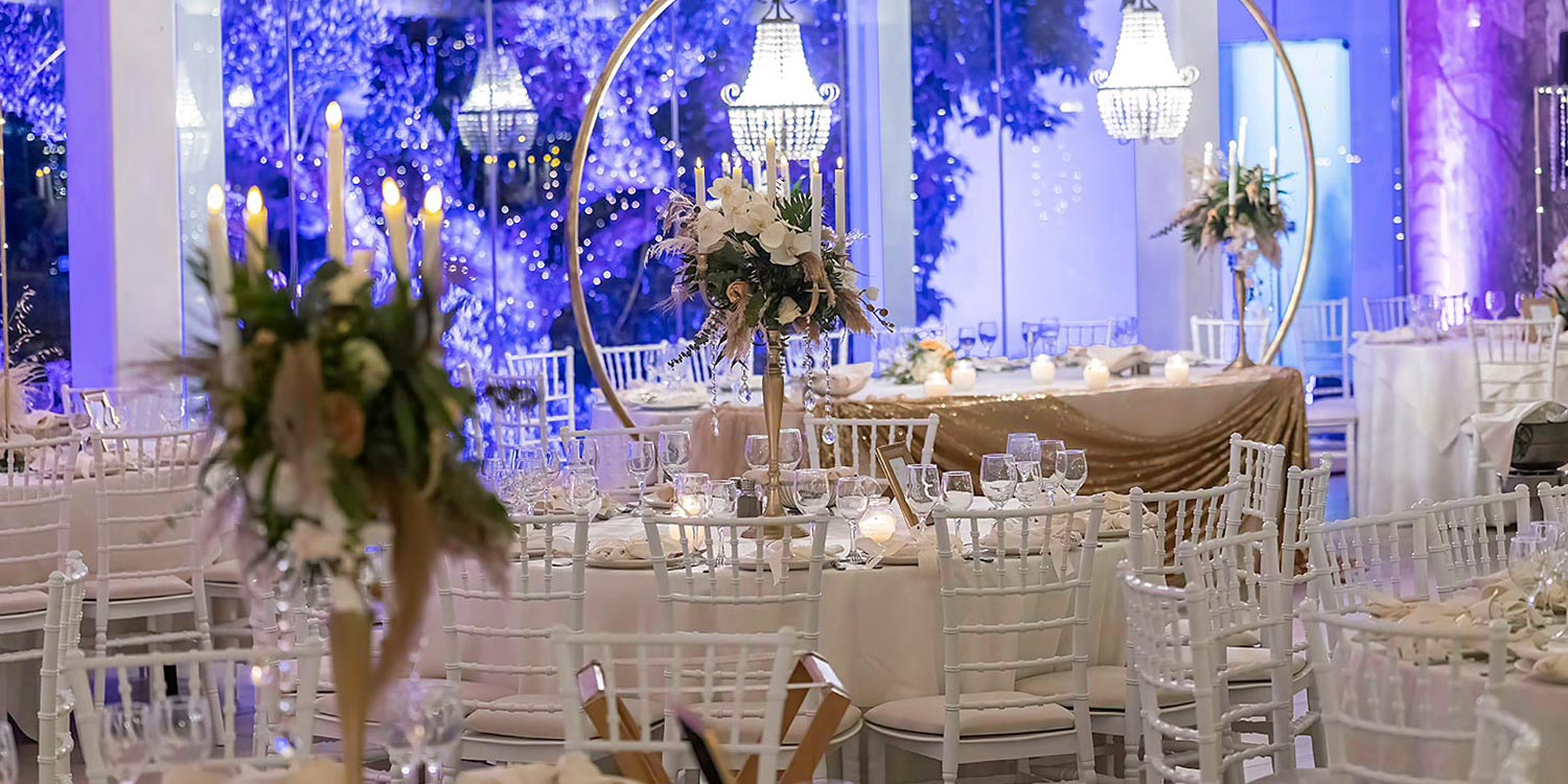 Trichonida Lake Wedding 35 Lake wedding at Pythari by Rogdaki Events—crystal chandeliers, candlelit tables, and floral elegance in a romantic hall