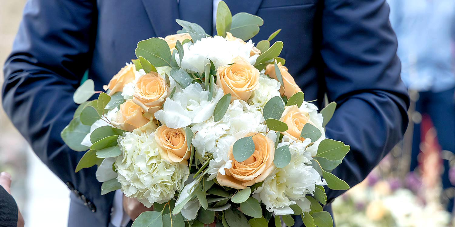 Trichonida Lake Wedding 11 Rogdaki Events captured elegance in agrinio with this bouquet—peonies, roses, and eucalyptus in hand.