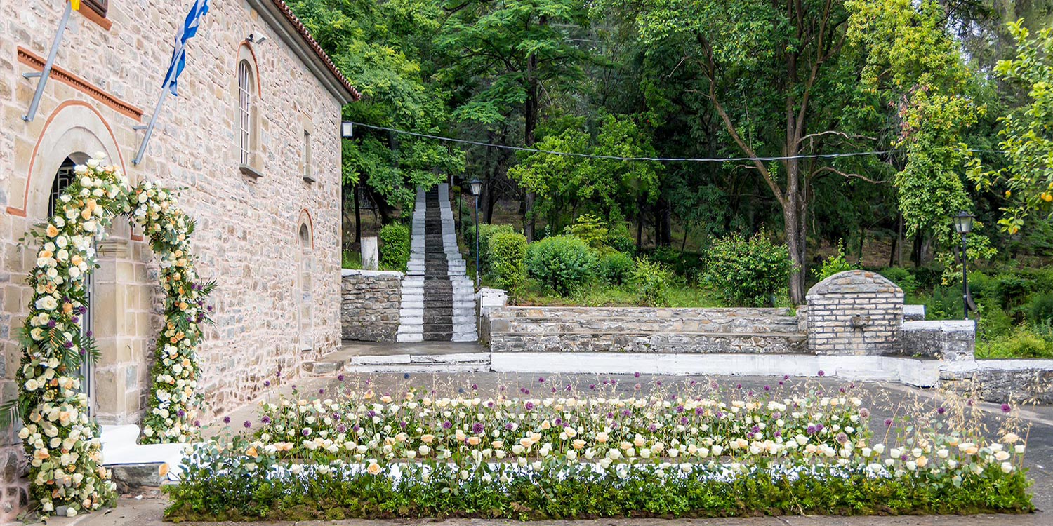 Trichonida Lake Wedding 2 Rogdaki Events framed this serene ceremony in agrinio with soft florals and timeless Orthodox elegance.