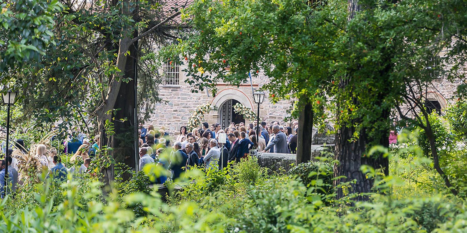 Trichonida Lake Wedding 9 Rogdaki Events gathered guests for a heartfelt ceremony in agrinio, framed by florals and forest serenity