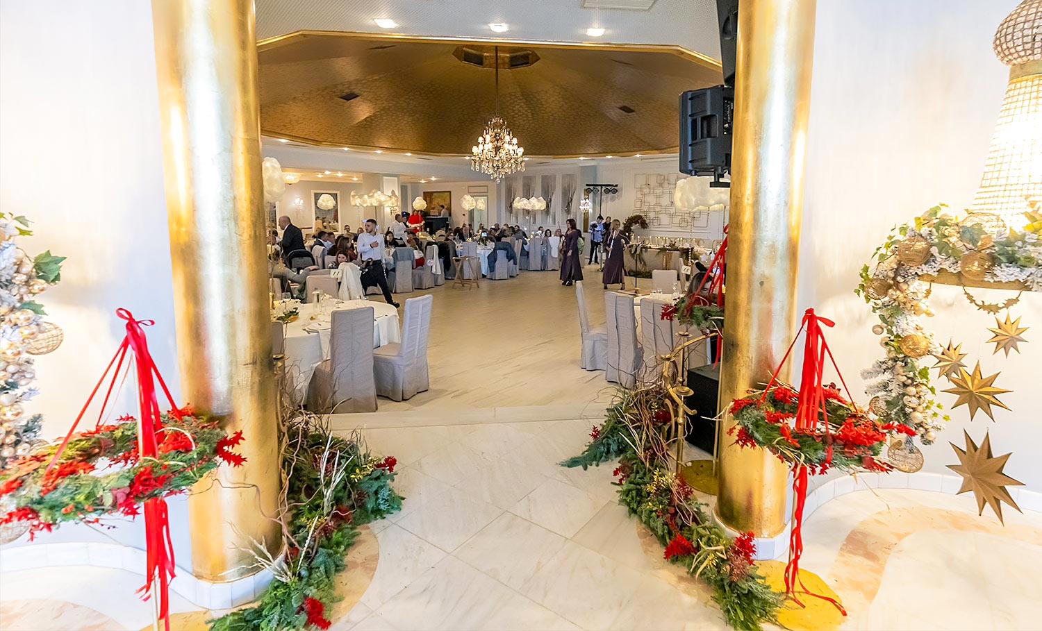 Baptism entrance at Pythari with gold accents and Christmas decoration by Rogdaki Events.