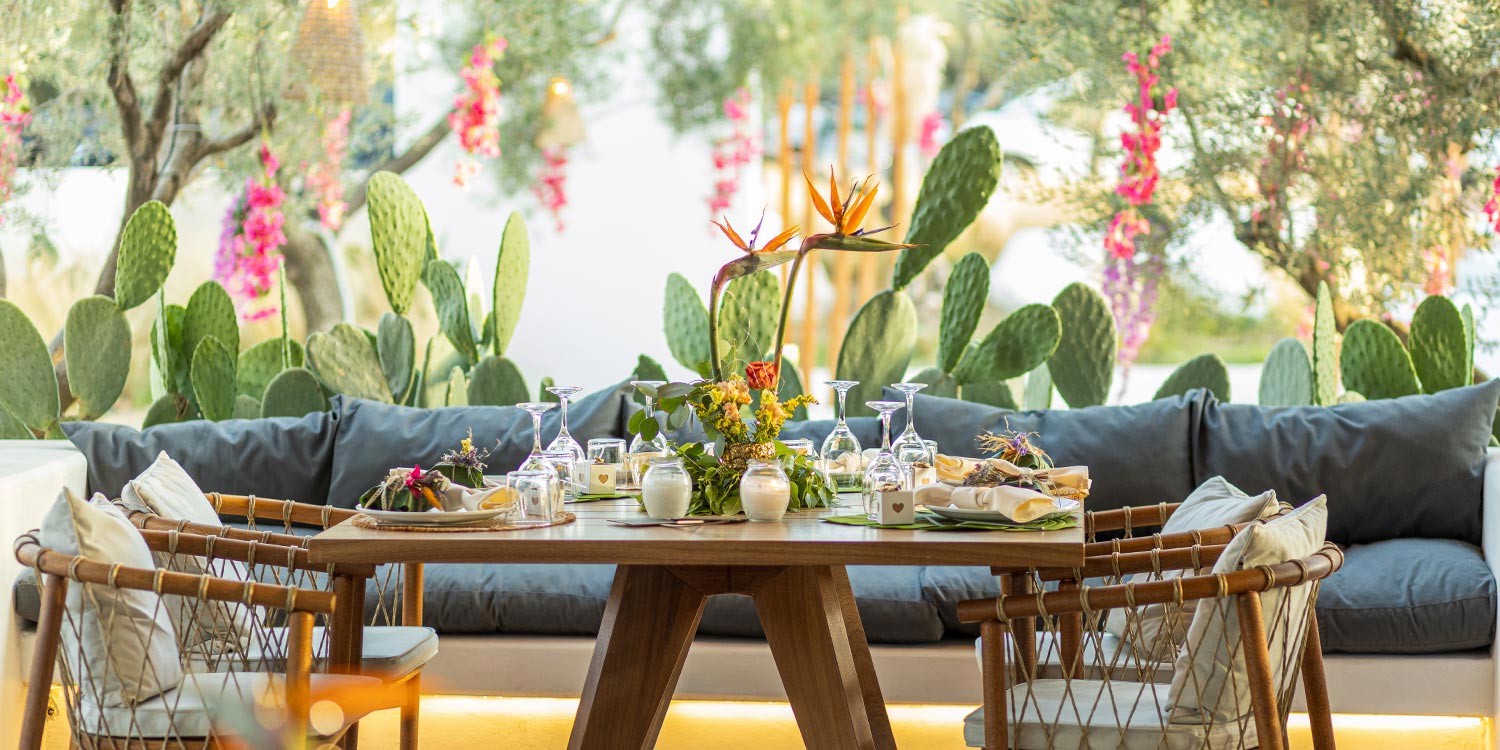 Dinner setup at ONA featuring birds of paradise and tropical elements by Rogdaki Events