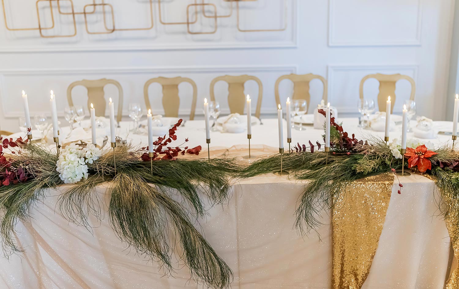 Elegant baptism decoration at Pythari featuring candles, pine branches, and the seasonal aesthetic of Rogdaki Events.