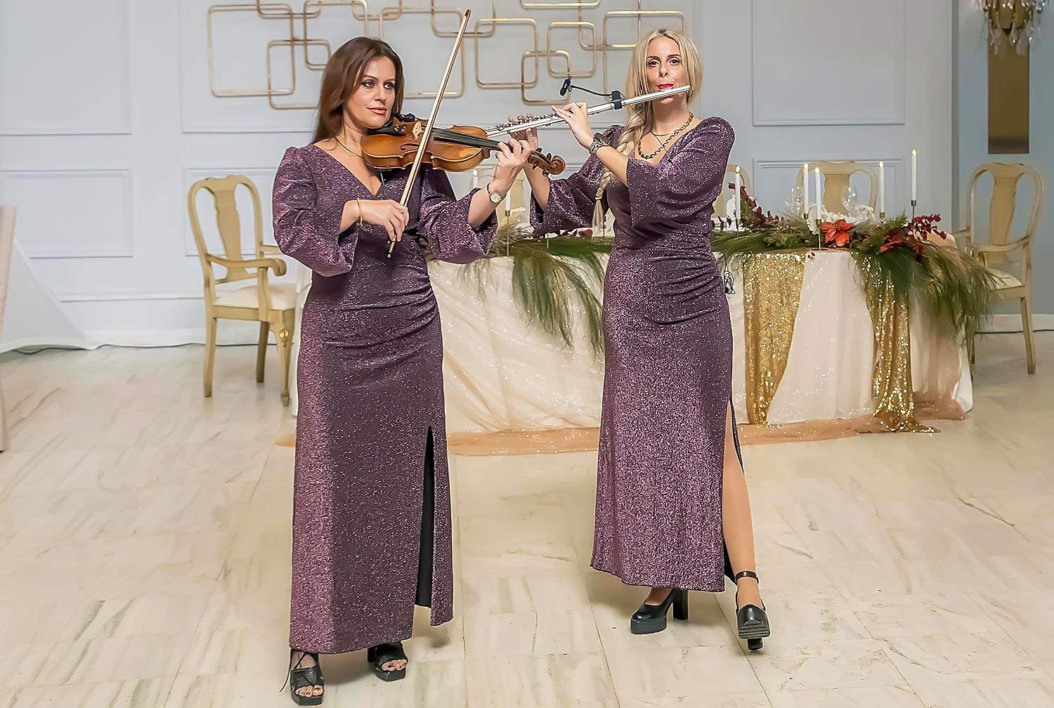 Elegant violin and flute duet enhancing the atmosphere of a beautifully styled event setting.