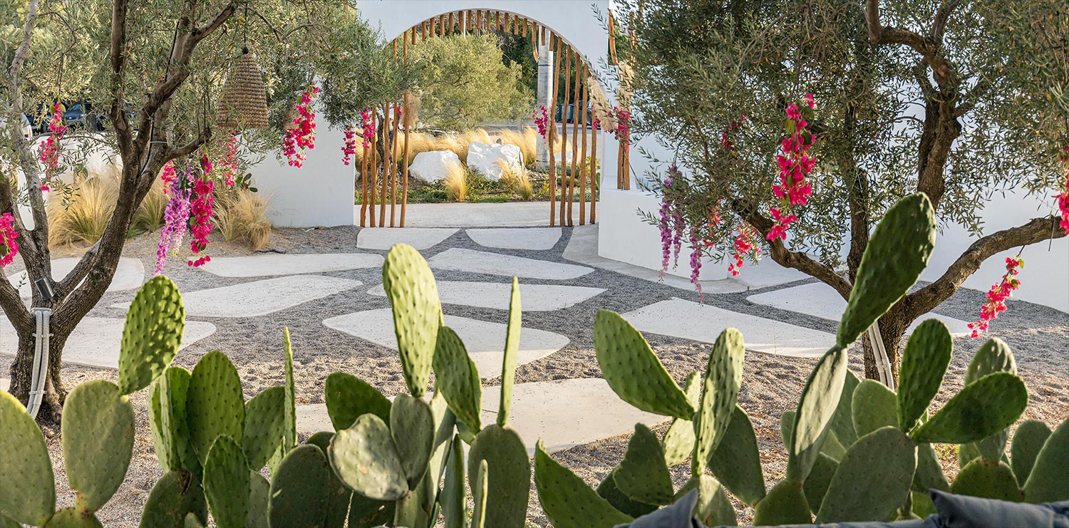ONA exterior with cacti and hanging flowers, styled by Rogdaki Events.