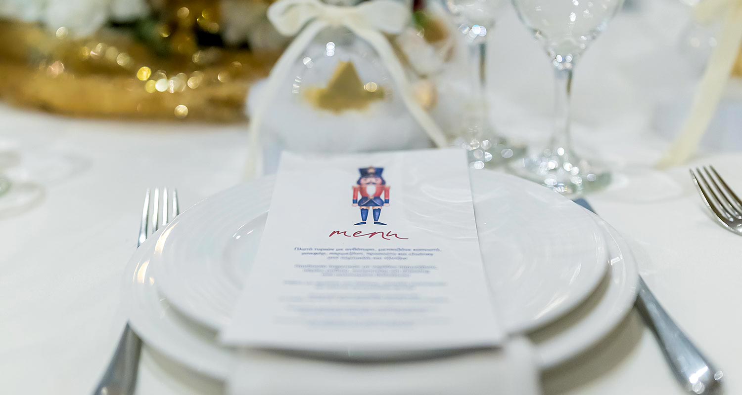 Rogdaki Events Design Christmas Baptism Clouds and Stars, a baptism menu featuring nutcracker graphics placed on a plate.