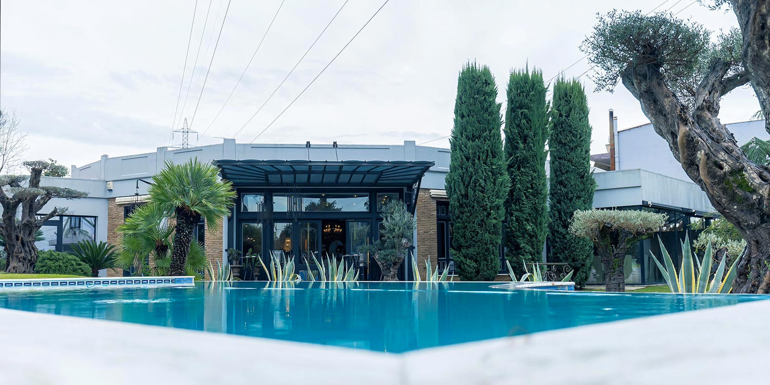 Rogdaki Events Design Christmas Baptism Clouds and Stars, an exterior view with the pool at Ktima Pythari in Agrinio.