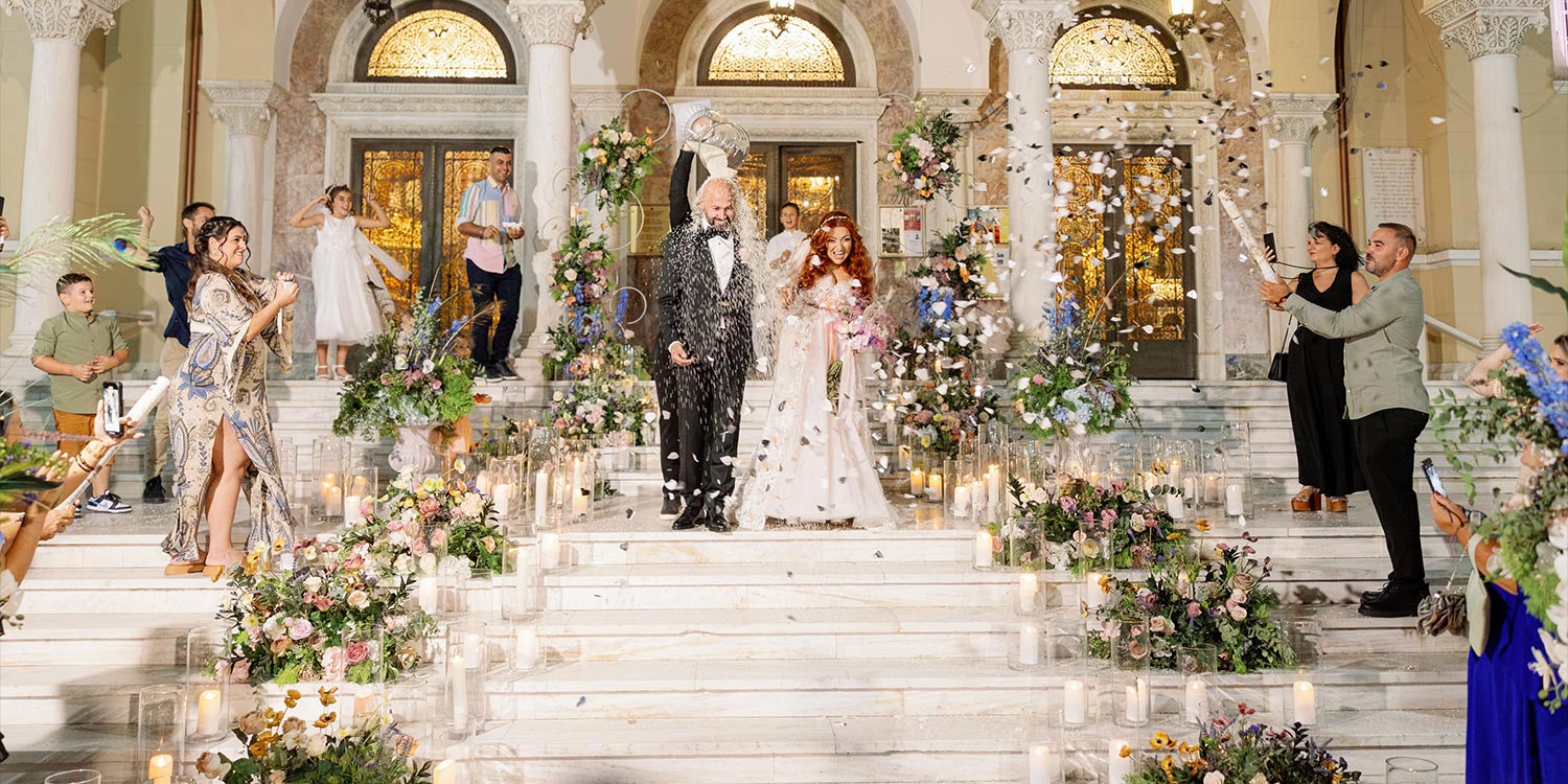 A Bridgerton Wedding in Greece 28 The couple's grand exit under a shower of rice for a wedding by Rogdaki Events.